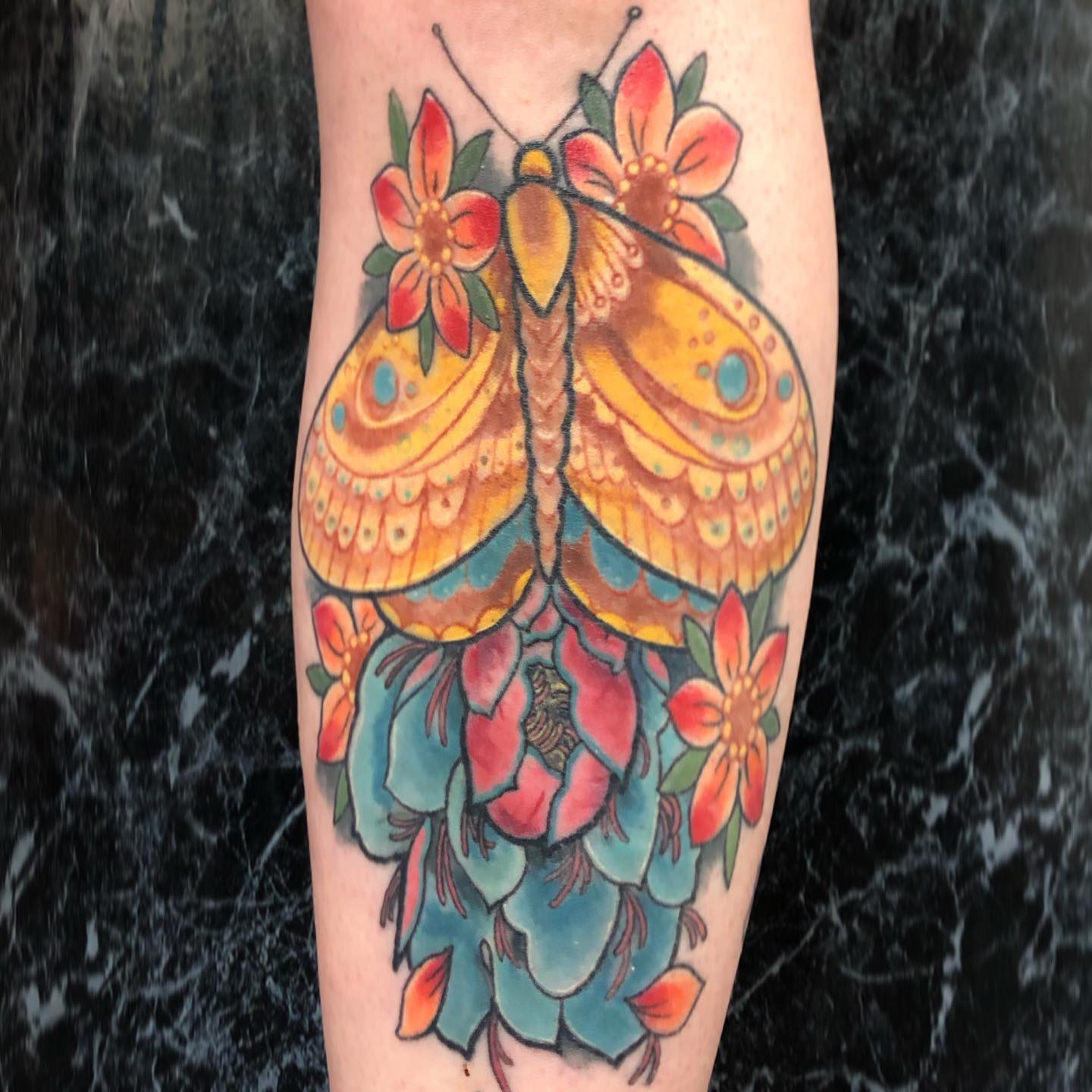 Healed Moth and Peony on the shin. Always love seeing tattoos that have settled in so well and bright. 

                   